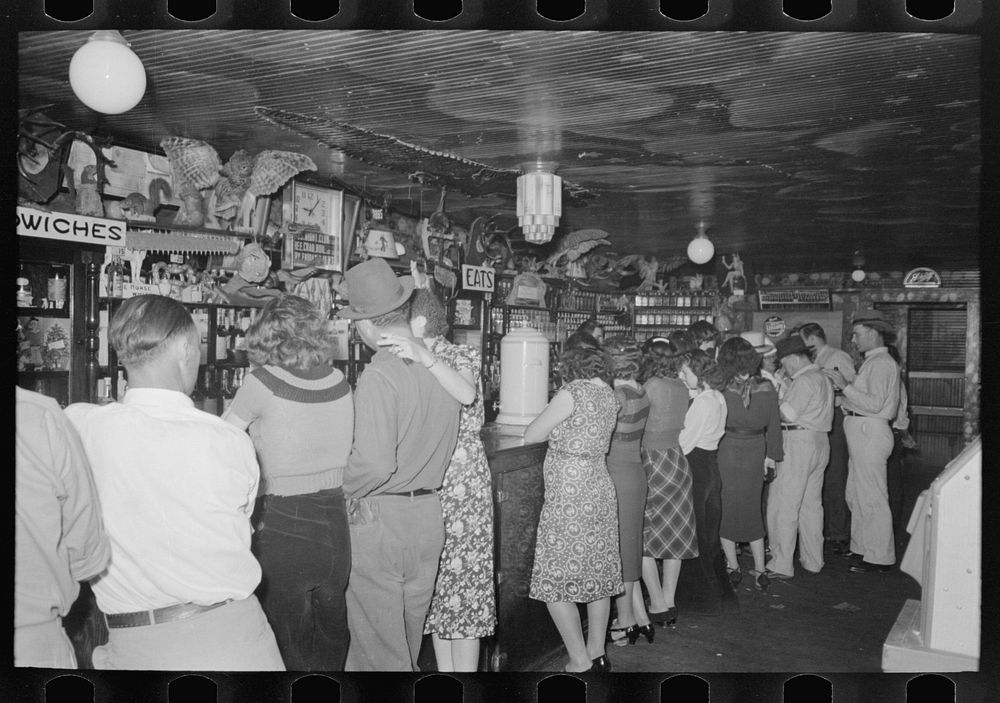 [Untitled photo, possibly related to: Drinking at the bar, saloon, Raceland, Louisiana] by Russell Lee