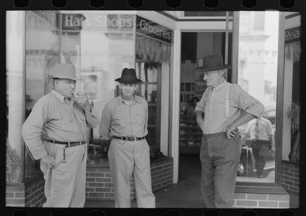 Farmers talking in front of old store, Crowley, Louisiana by Russell Lee