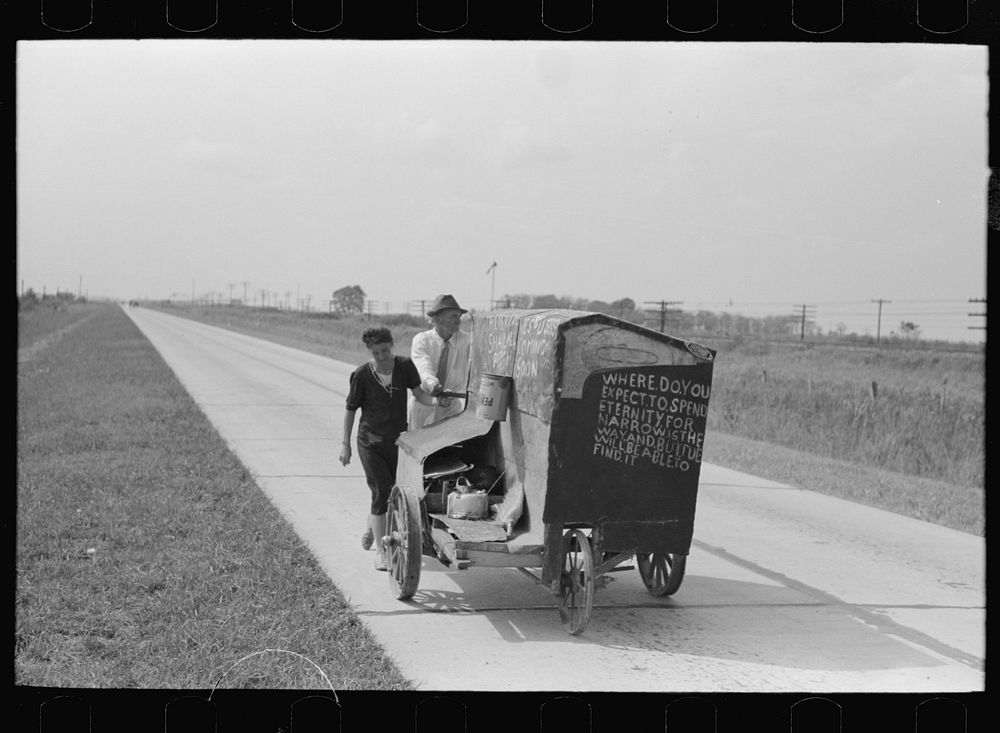 [Untitled photo, possibly related to: Traveling evangelists pushing cart on road between Lafayette and Scott, Louisiana] by…