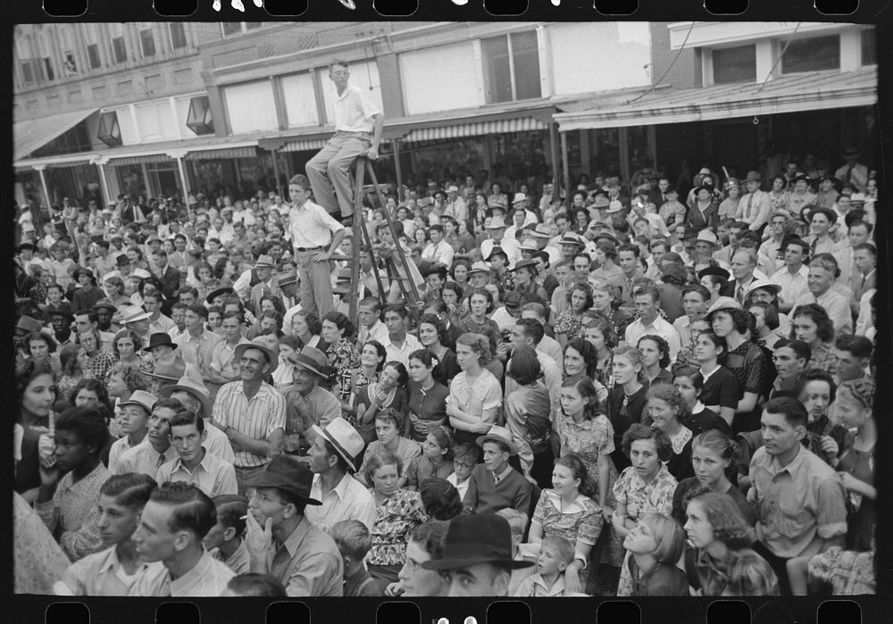 Crowd, listening to the Cajun band at National Rice Festival, Crowley, Louisiana by Russell Lee