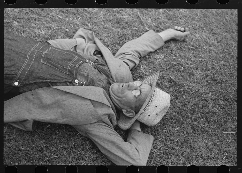 Farmer at National Rice Festival taking a rest, Crowley, Louisiana by Russell Lee