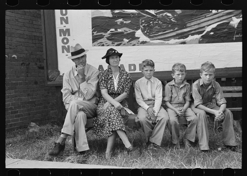 Family waiting for parade, National Rice Festival, Crowley, Louisiana by Russell Lee