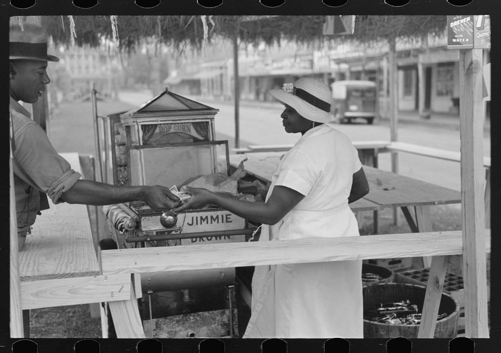 Paying for supplies delivered to concession, National Rice Festival, Crowley, Louisiana by Russell Lee