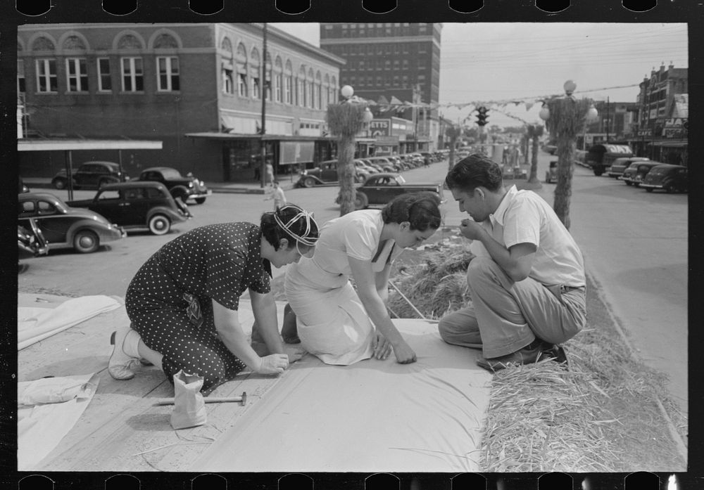 [Untitled photo, possibly related to: Tacking canvas on steps of queen's platform, National Rice Festival, Crowley…