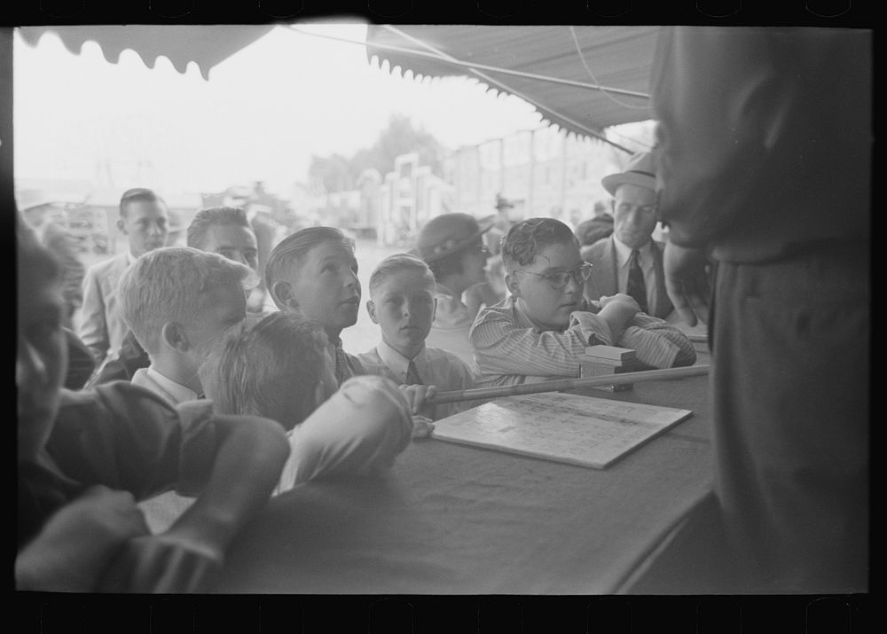 Boys standing at counter of concession, state fair, Donaldsonville, Louisiana by Russell Lee