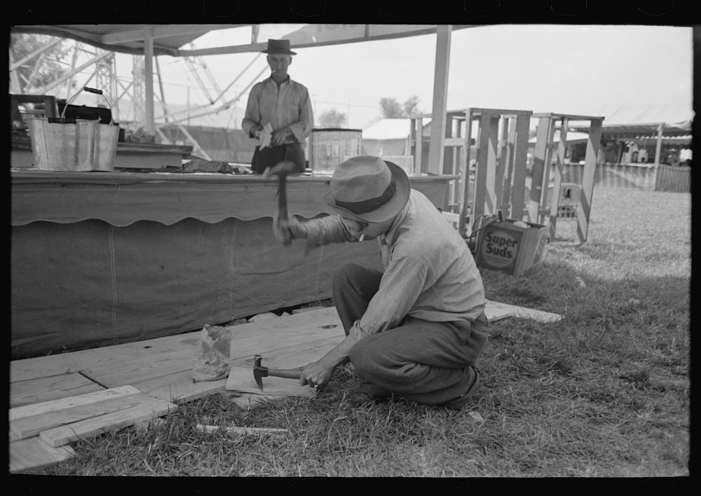 [Untitled photo, possibly related to: Tossing rings at objects in concessions, state fair, Donaldsonville, Louisiana] by…