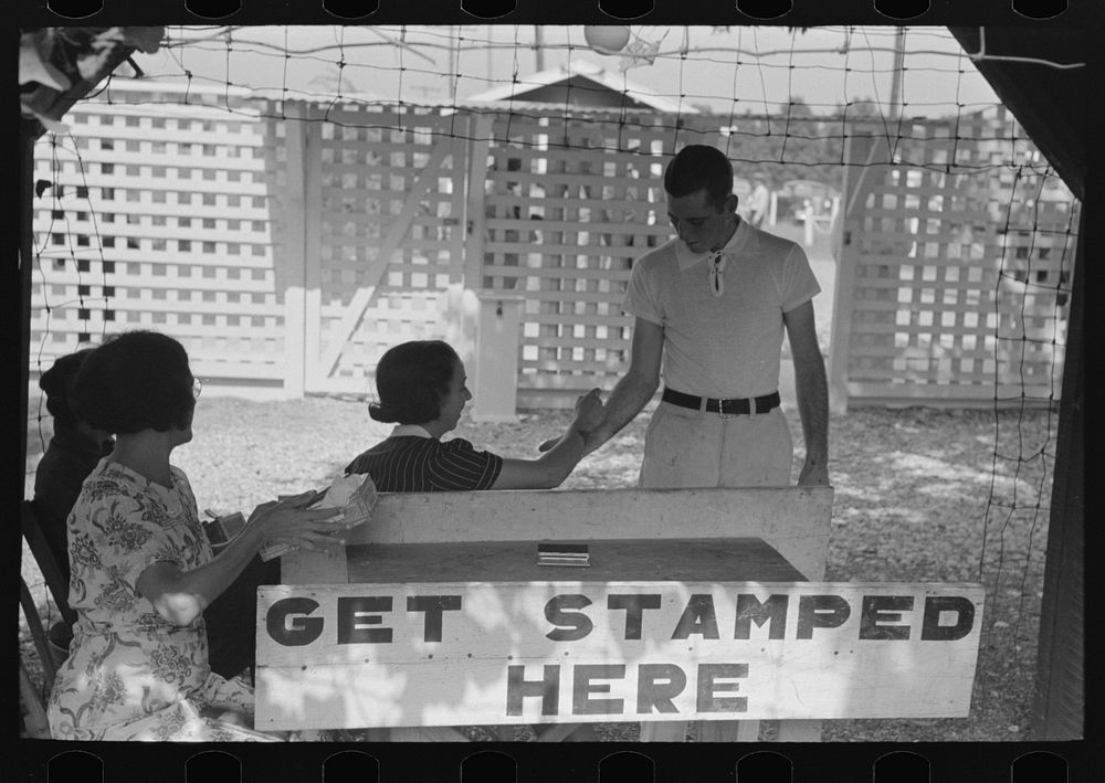 [Untitled photo, possibly related to: Everyone must be stamped to gain readmittance, for identification, state fair…