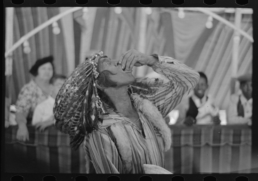 [Untitled photo, possibly related to: Indian glass eater, state fair, Donaldsonville, Louisiana] by Russell Lee