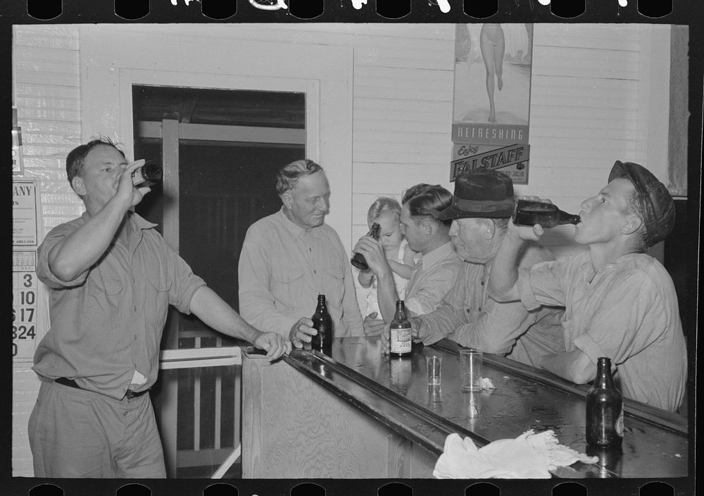 Drinking at the bar in Pilottown, Louisiana by Russell Lee