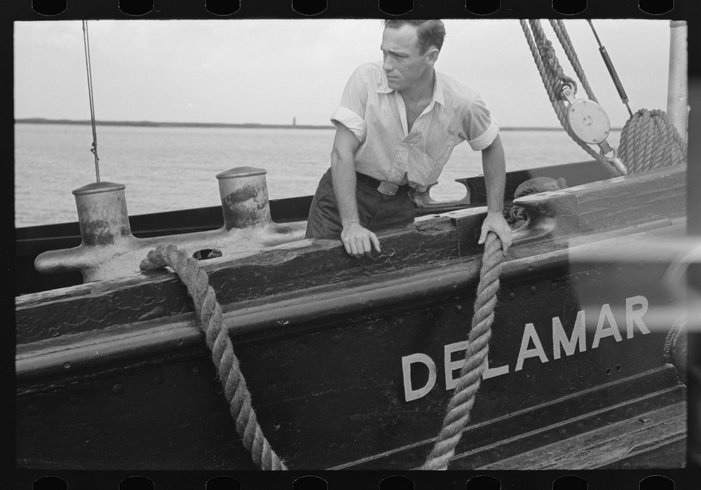 Deck hand on U.S. Engineers' tugboat, Burrwood, Louisiana by Russell Lee