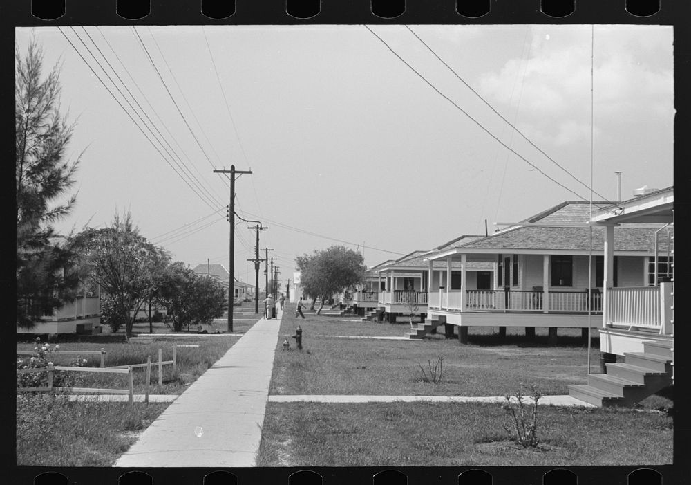 Row of cottages, Burrwood, Louisiana. This is chiefly a base for dredging operations of U.S. Engineering Corps by Russell Lee