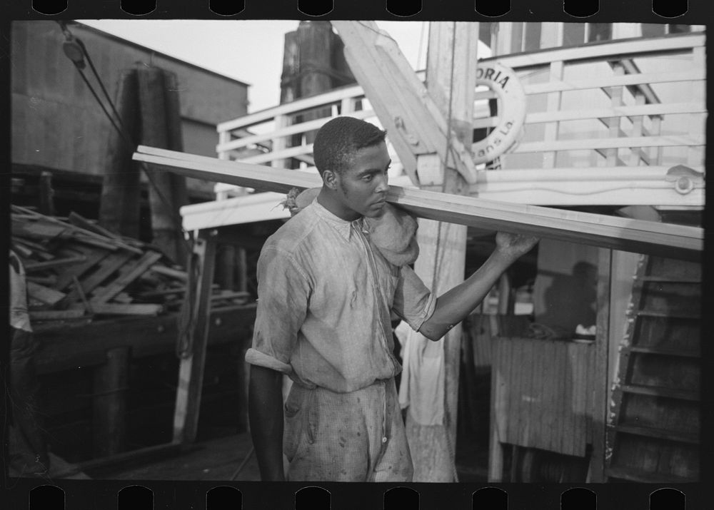  stevedore, with lumber on shoulder, New Orleans, Louisiana by Russell Lee