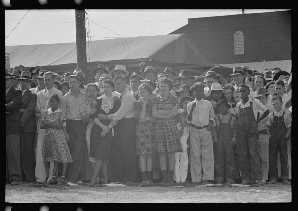 [Untitled photo, possibly related to: Two boys leaning on fence watching parade, state fair, Donaldsonville, Louisiana] by…