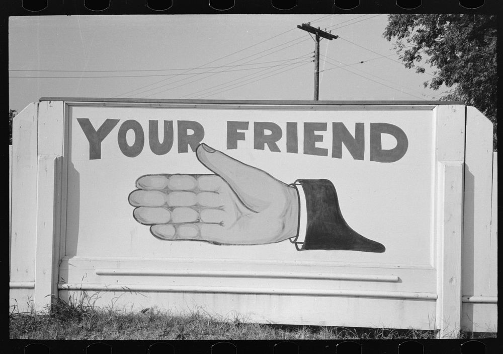 Sign at gas station, advertising a particular brand of petroleum product, New Iberia, Louisiana by Russell Lee