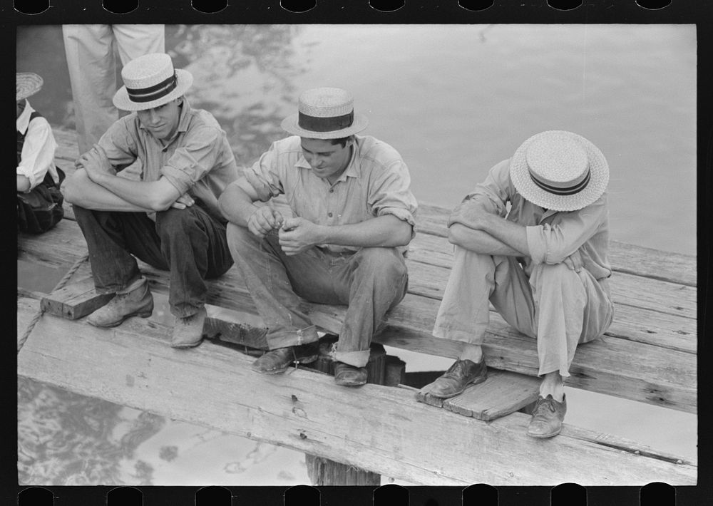 Natives of Boothville, Louisiana on dock by Russell Lee