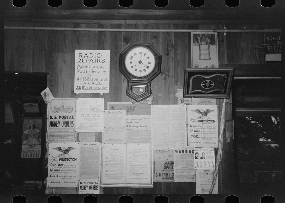Posters and decorations in combined general store and post office, Olga, Louisinan by Russell Lee