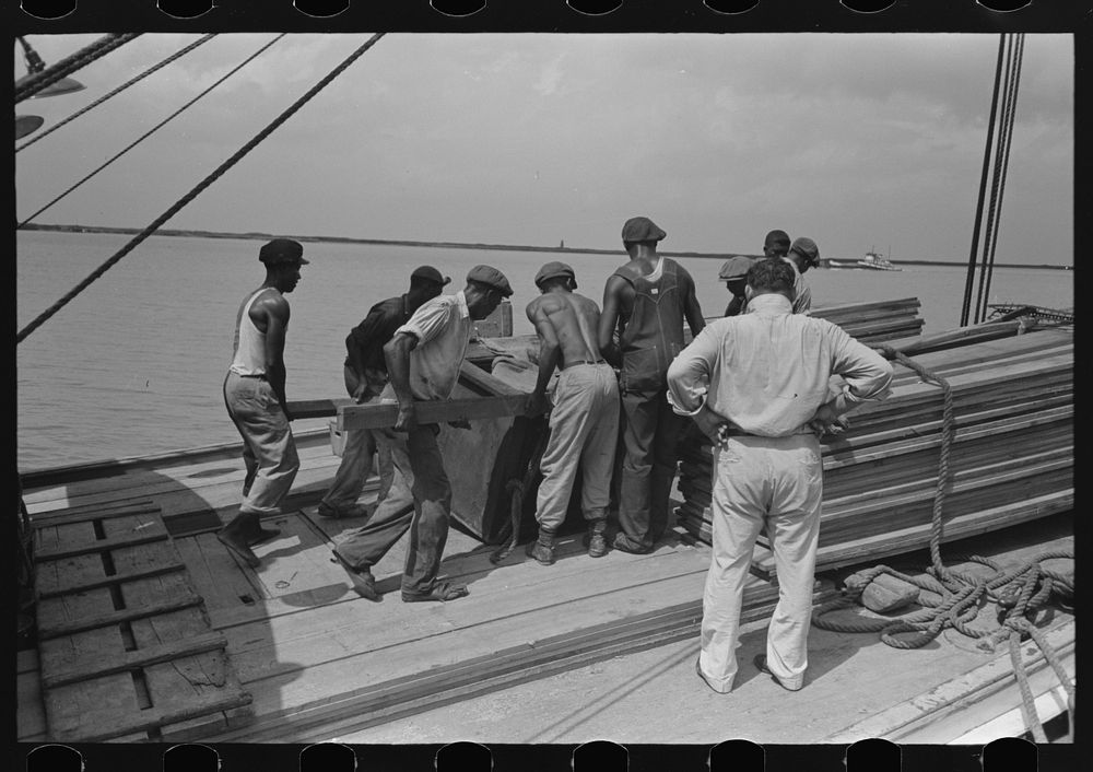 Stevedores at work on bow of packet boat El Rito on lower Mississippi River by Russell Lee