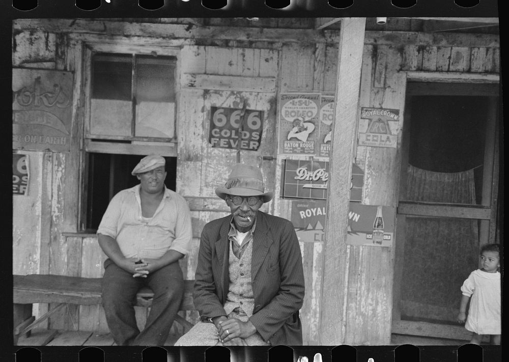 [Untitled photo, possibly related to: Men talking on porch of small store near Jeanerette, Louisiana] by Russell Lee
