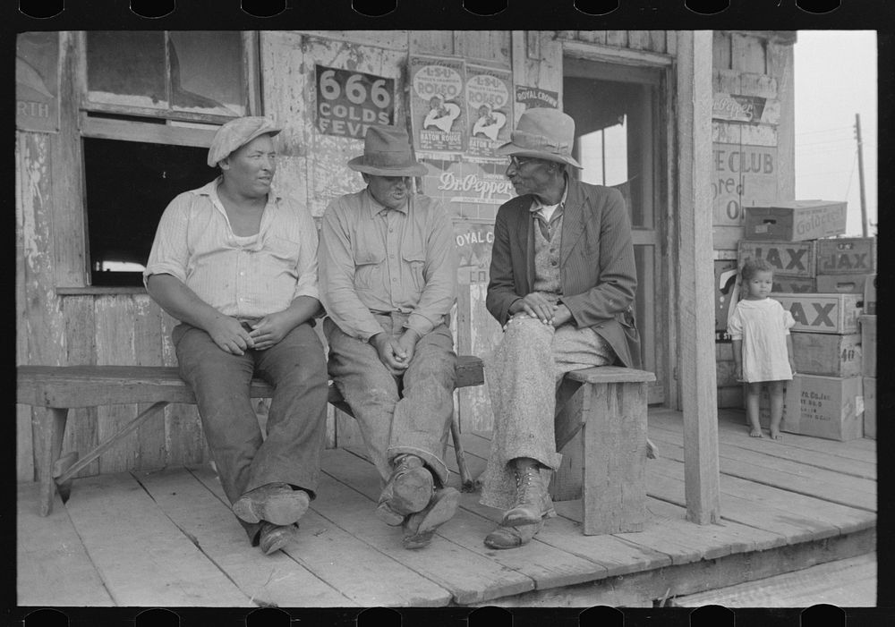 [Untitled photo, possibly related to: es talking on porch of small store near Jeanerette, Louisiana] by Russell Lee