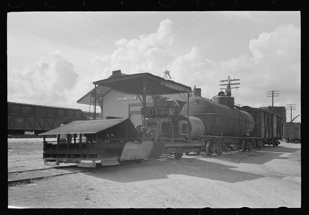Railroad weed burner being fueled, Port Barre, Louisiana by Russell Lee