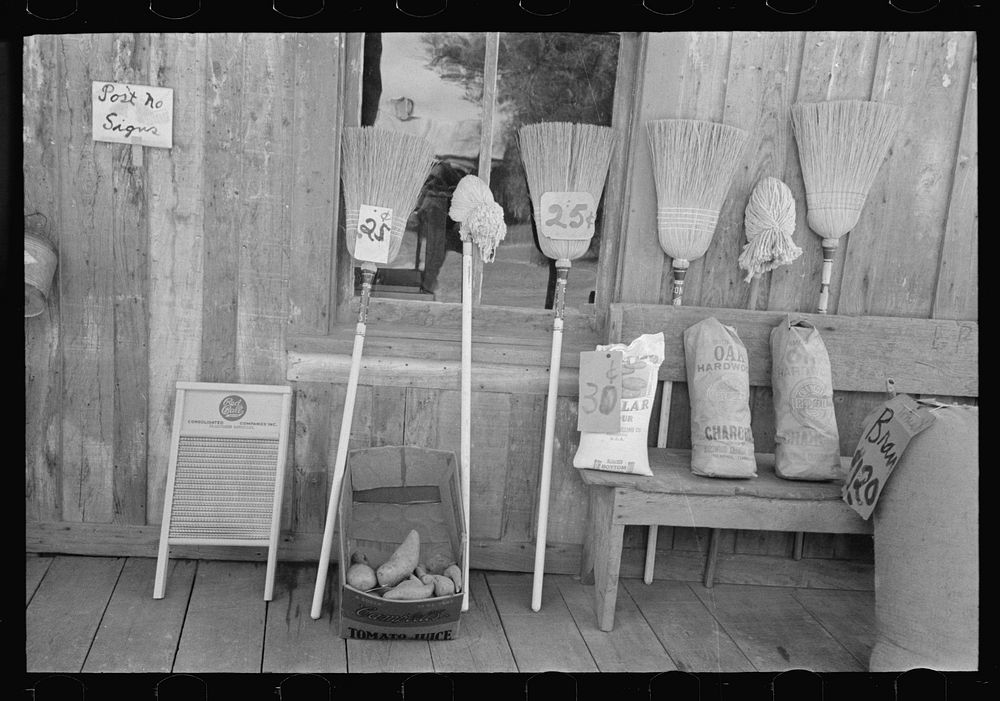 Brooms and charcoal for sale, Jeanerette, Louisiana by Russell Lee