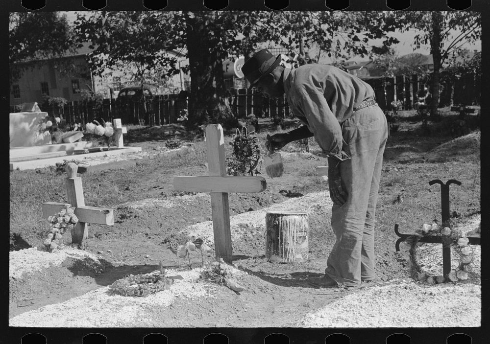 [Untitled photo, possibly related to: Painting grave marker in cemetery, All Saints' Day in New Roads, Louisiana] by Russell…