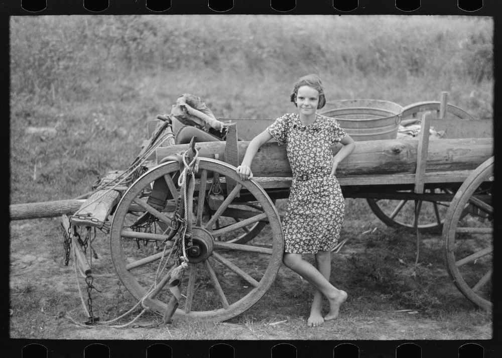 [Untitled photo, possibly related to: Farm girl leaning on wagon, near Morganza, Louisiana] by Russell Lee