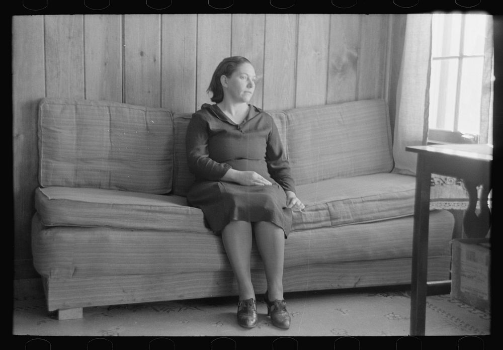 [Untitled photo, possibly related to: Wife of Chicot Farms homesteader sitting on homemade sofa, Chicot Farms, Arkansas] by…