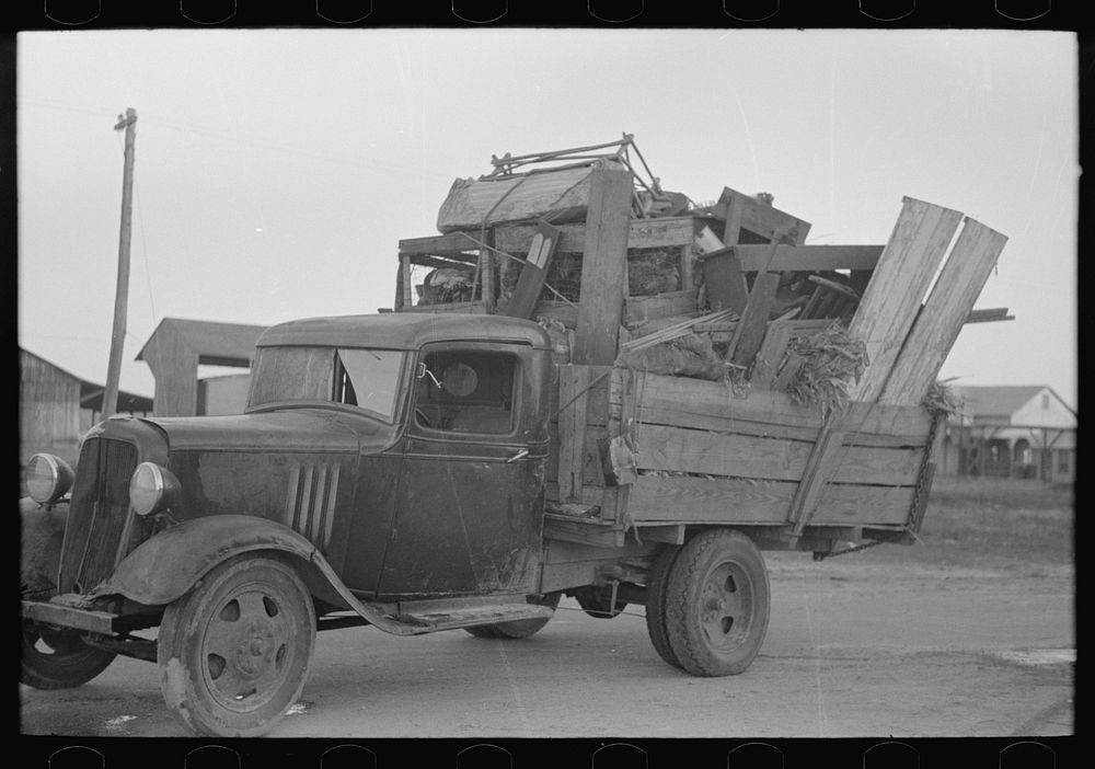 [Untitled photo, possibly related to: Truckload of belongings of farmer moving, Chicot County, Arkansas] by Russell Lee