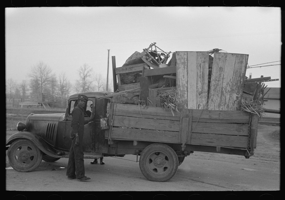 Truckload of belongings of farmer moving, Chicot County, Arkansas by Russell Lee