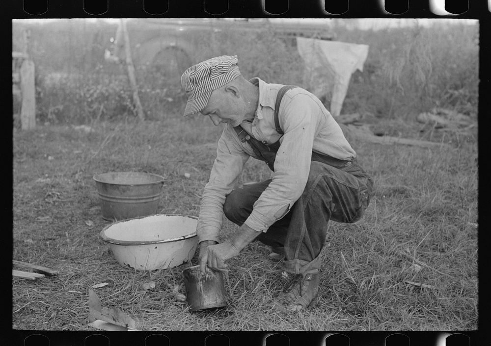 [Untitled photo, possibly related to: Day laborer working around his shack near New Iberia, Louisiana] by Russell Lee