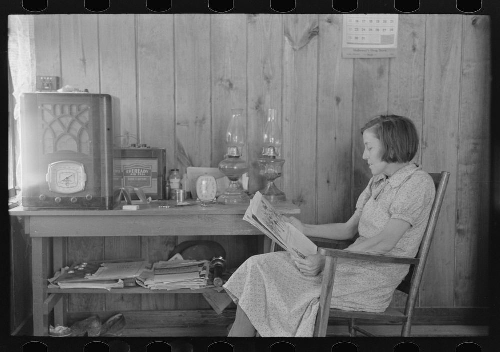[Untitled photo, possibly related to: House wife reading in living room, Chicot Farms, Arkansas] by Russell Lee