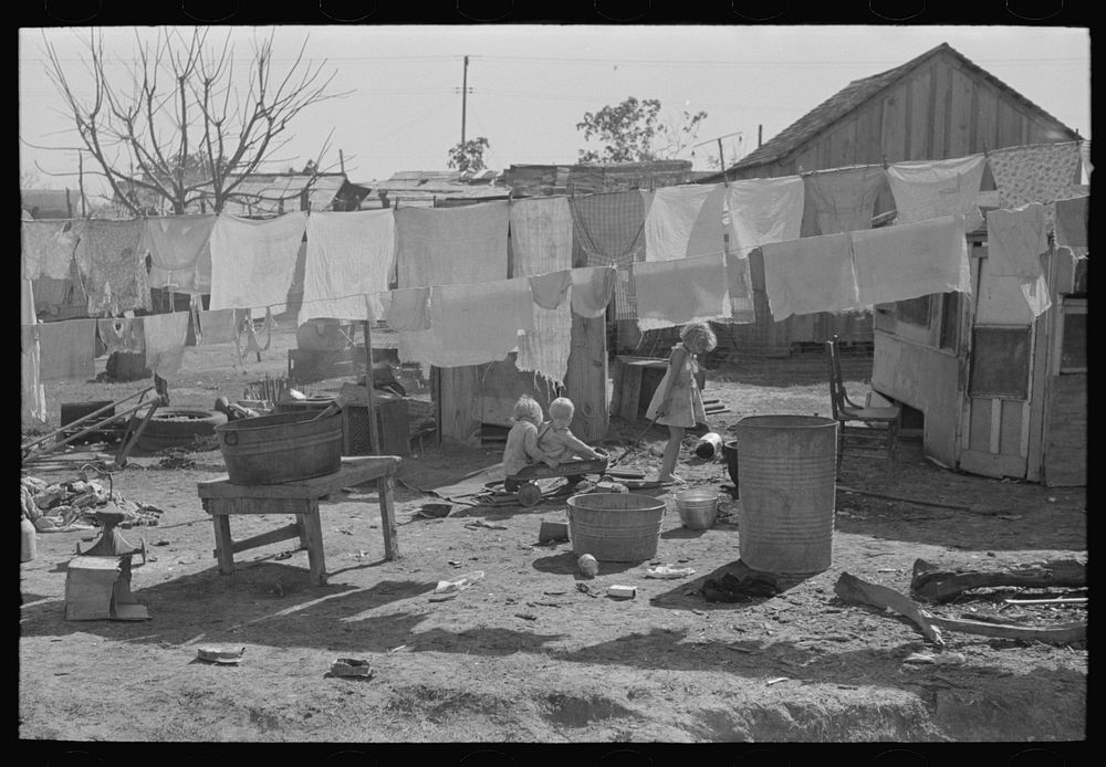 Clothesline in back of house in poorer section of Weslaco, Texas by Russell Lee