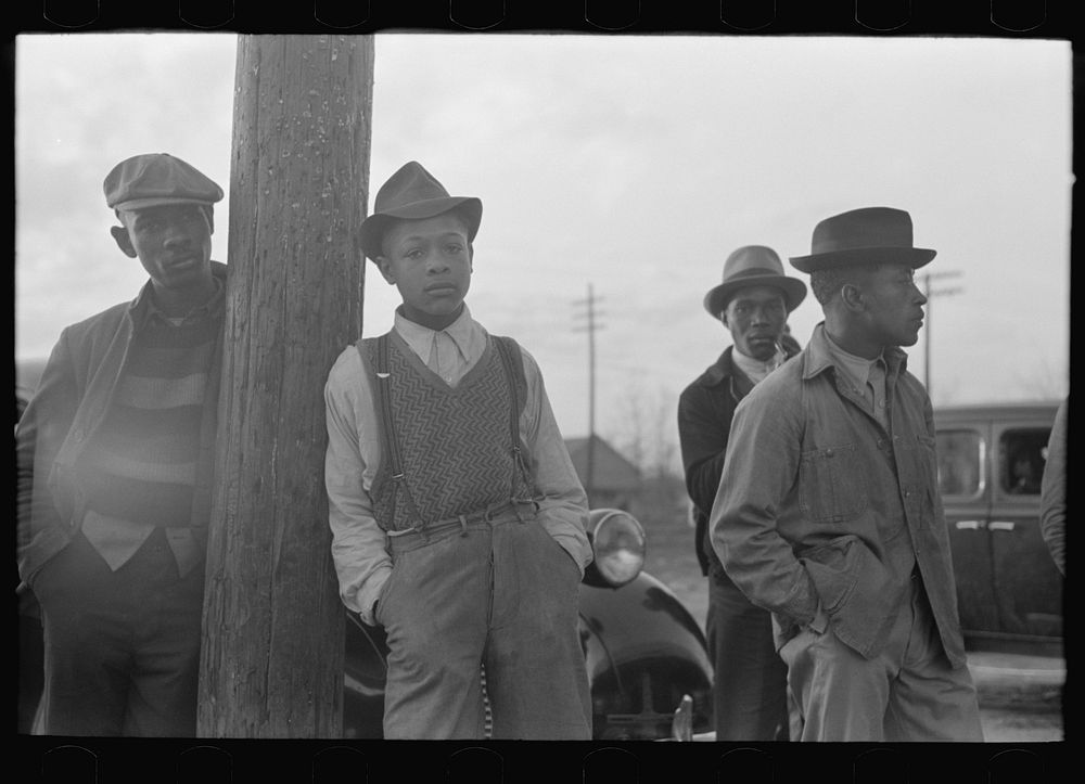 [Untitled photo, possibly related to: Men waiting for church to open, Mound Bayou, Mississippi] by Russell Lee