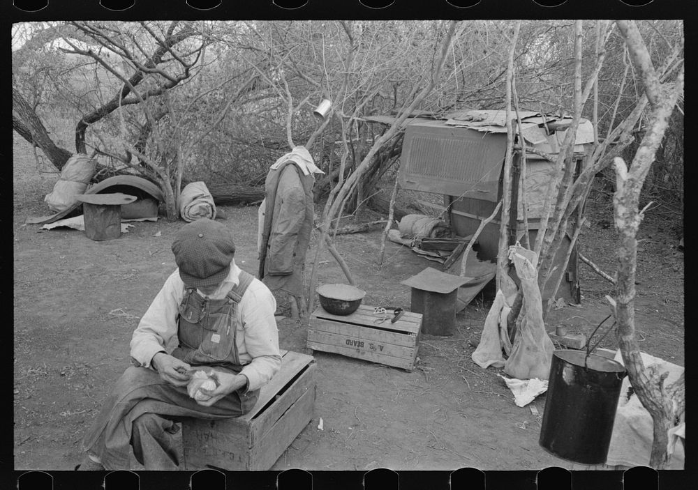 White migrant worker living in camp with two other migrant men. His sleeping quarters and all worldly possession are to be…