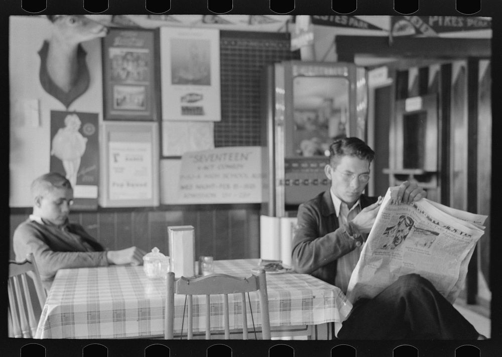 [Untitled photo, possibly related to: Boys sitting at table in restaurant, Raymondville, Texas] by Russell Lee