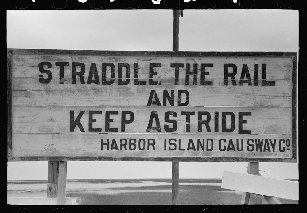 Sign on causeway from Port Aransas to Pass Aransas, Texas by Russell Lee