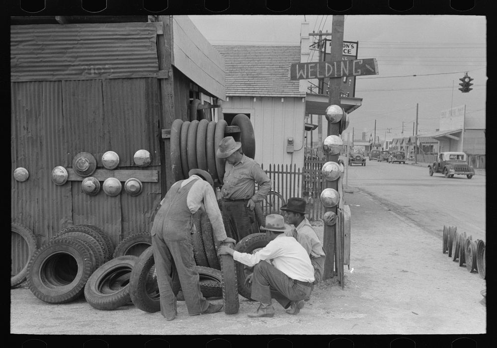 Group of men inspecting secondhand tires for sale, Corpus Christi, Texas by Russell Lee