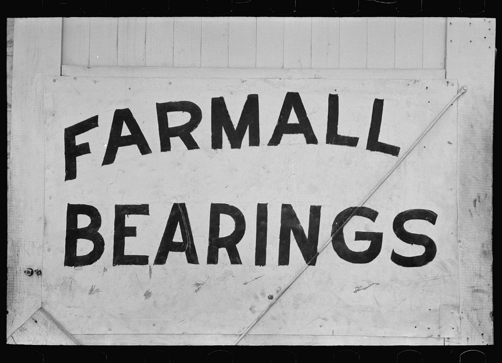 Sign showing need for replacing parts in tractors, Robstown, Texas by Russell Lee