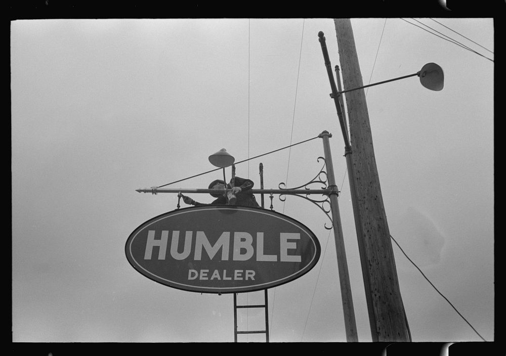 Man erecting sign near Alice, Texas by Russell Lee