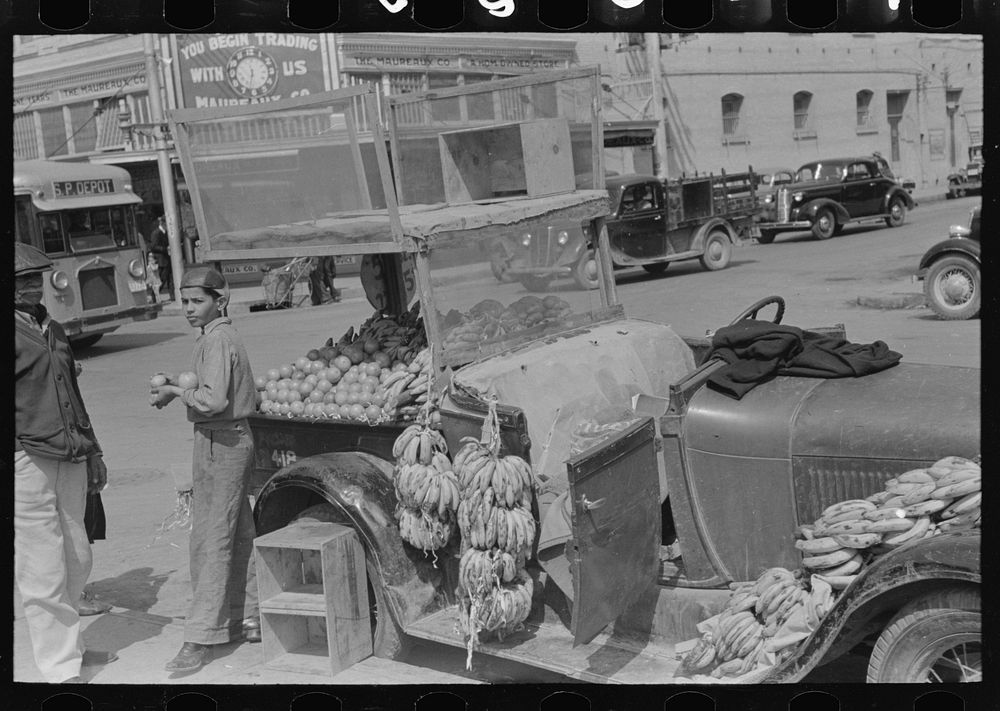 [Untitled photo, possibly related to: Front of peddler's car, market, San Antonio, Texas] by Russell Lee