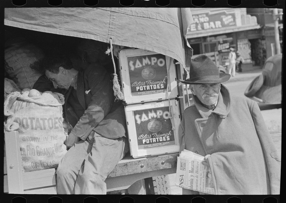 Potato peddler and newsboy, market, San Antonio, Texas by Russell Lee