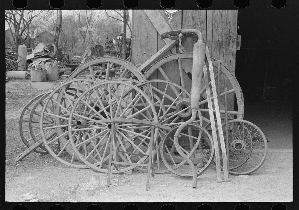 Wheels and automobile muffler, San Antonio, Texas by Russell Lee