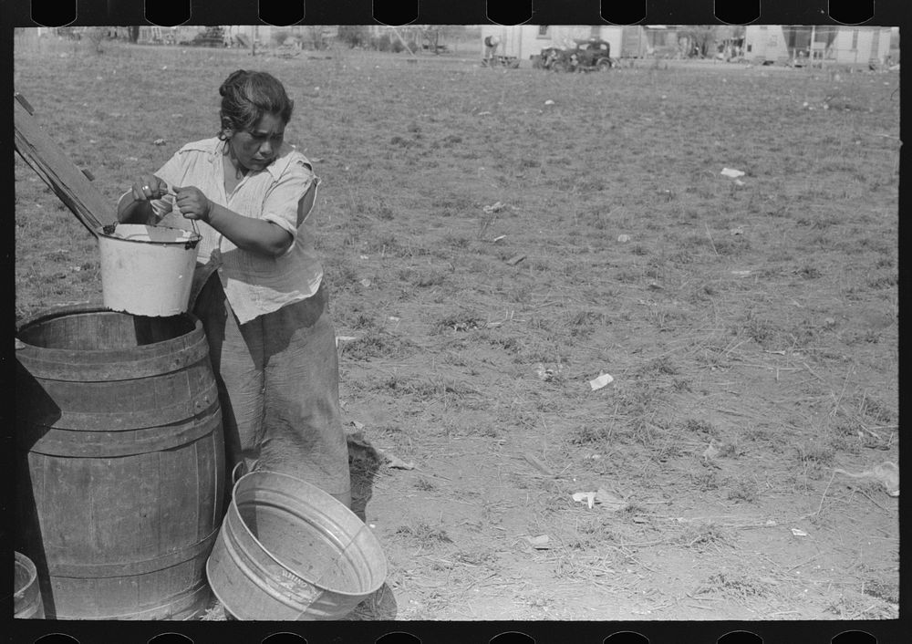 [Untitled photo, possibly related to: San Antonio. The Mexican section. Water supply of Mexican family living on the…