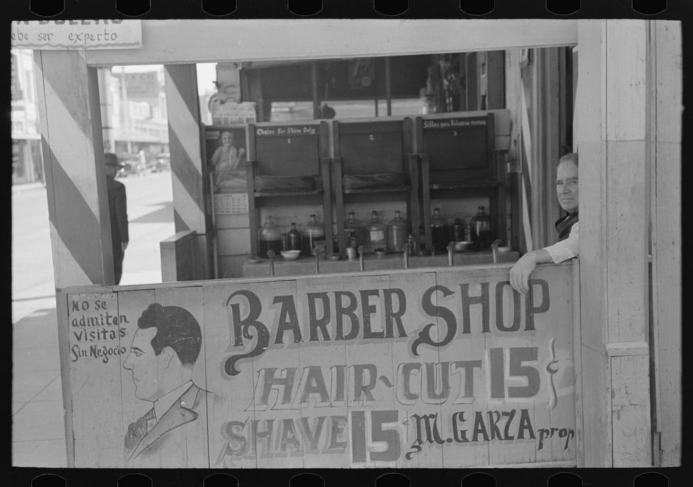 [Untitled photo, possibly related to: Decorations in front of Mexican barbershop, San Antonio, Texas] by Russell Lee