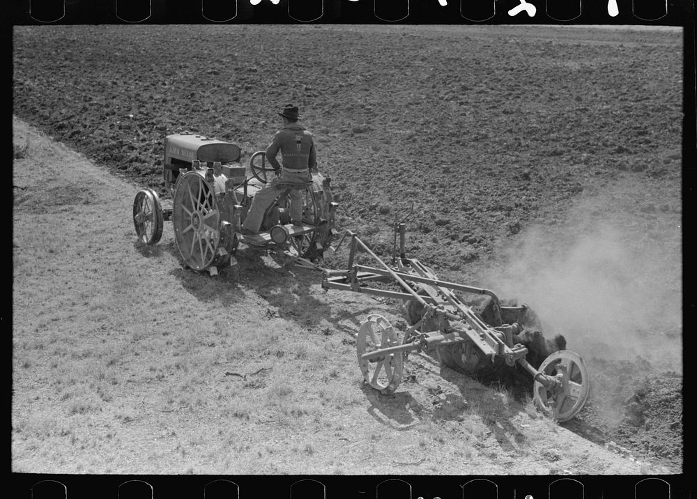 Breaking virgin soil with tractor and plow, El Indio, Texas by Russell Lee