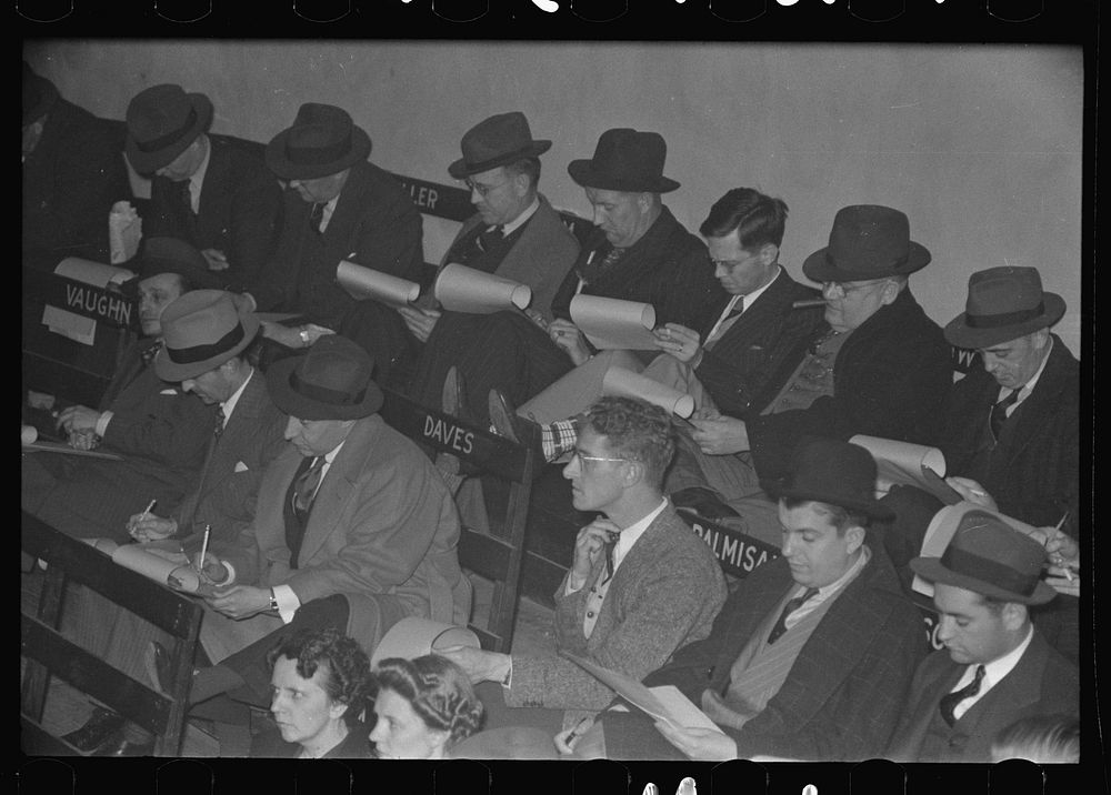 Group of buyers at strawberry auction, Hammond, Louisiana. Third man from right in front row is bidding by Russell Lee