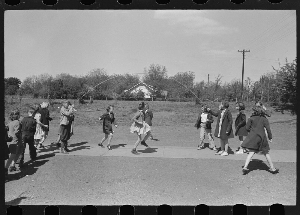 Schoolchildren jumping rope, San Augustine, Texas by Russell Lee