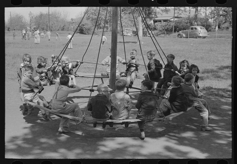 Schoolchildren on circular swing, San Augustine, Texas by Russell Lee