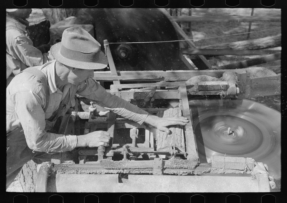 Sawing shingles by means of horizontal circular saw at small mill near Jefferson, Texas by Russell Lee